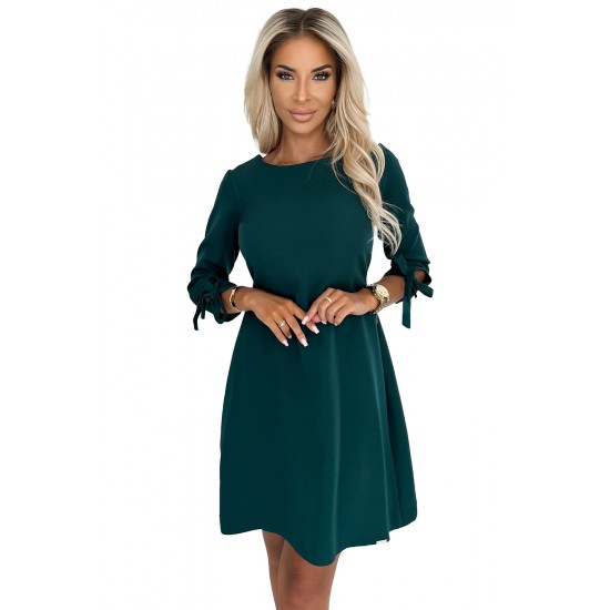 Елегантна рокля с връзки в зелен цвят 195-11 Елегантна рокля с връзки в зелен цвят 195-11