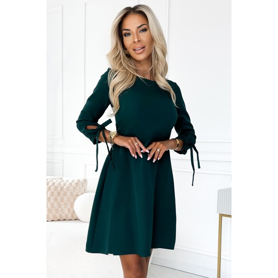 Елегантна рокля с връзки в зелен цвят 195-11 Елегантна рокля с връзки в зелен цвят 195-11