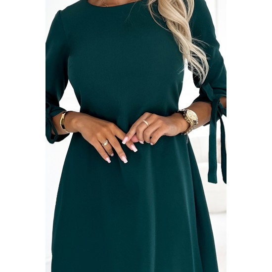 Елегантна рокля с връзки в зелен цвят 195-11 Елегантна рокля с връзки в зелен цвят 195-11
