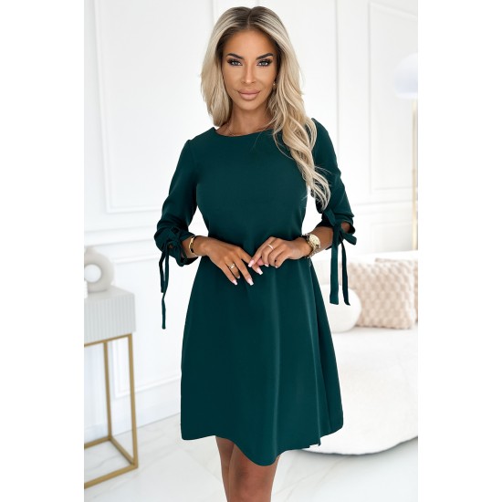 Елегантна рокля с връзки в зелен цвят 195-11 Елегантна рокля с връзки в зелен цвят 195-11